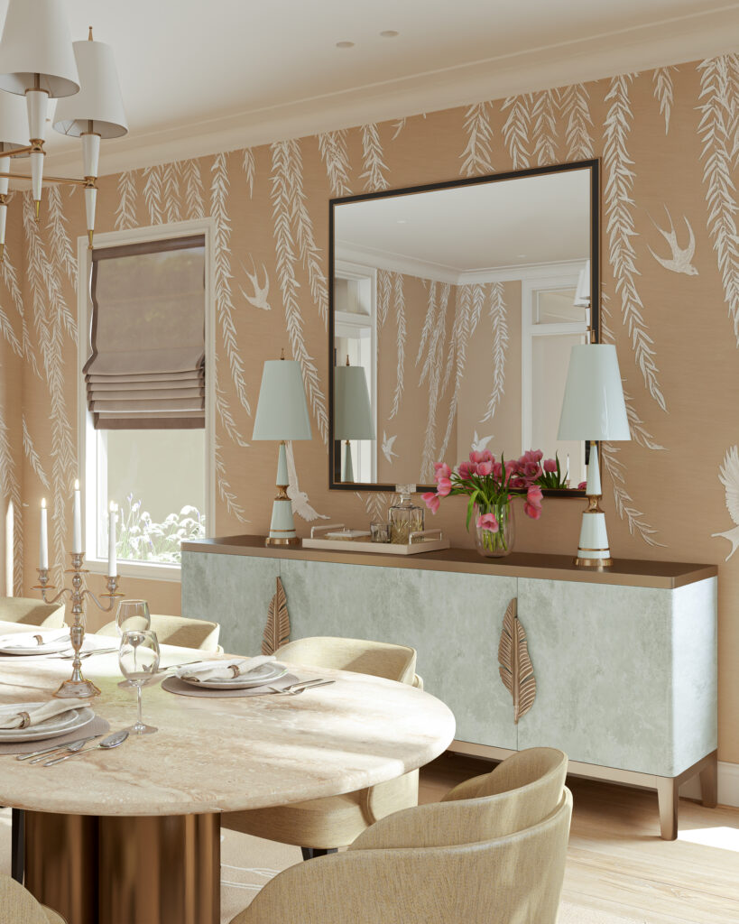 Phòng ăn với bàn tròn đá cẩm thạch, ghế bọc vải màu be, tủ console màu xanh nhạt với tay nắm hình lá vàng, và tường dán giấy họa tiết cây liễu và chim. / Dining room with a round marble table, beige upholstered chairs, a light blue console cabinet with gold leaf-shaped handles, and walls adorned with willow and bird pattern wallpaper.